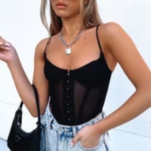 White fox boutique. NEVER WORN. Black corset in perfect condition
